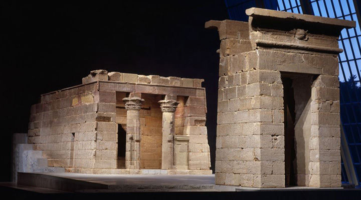 An Egyptian temple subtly illuminated in a dark gallery