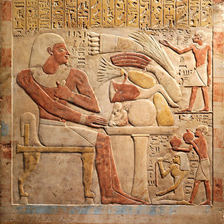 An umber figure sits on a chair on a relief
