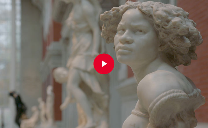 Video still of a marble bust of a woman in a sculpture hall at The Met.