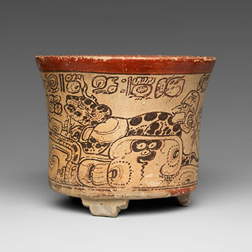 A flesh toned pot with dark brown animal markings