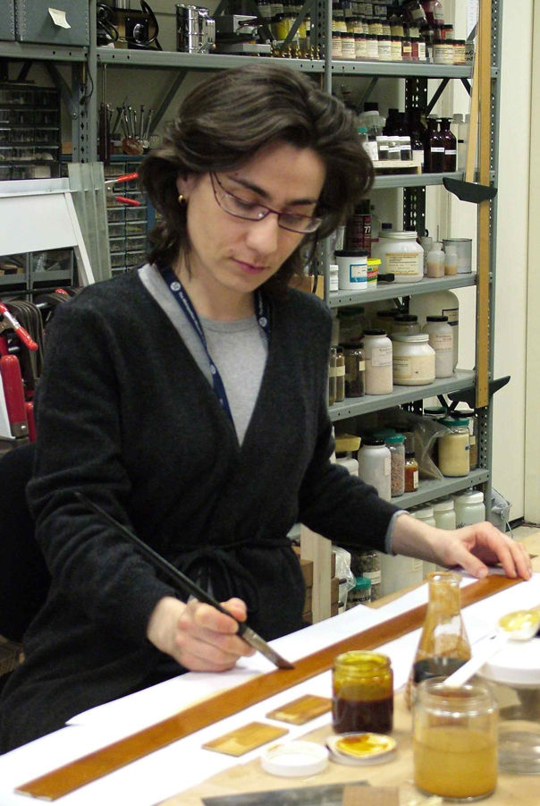 Susana Caldeira staining piece of wood in conservation lab